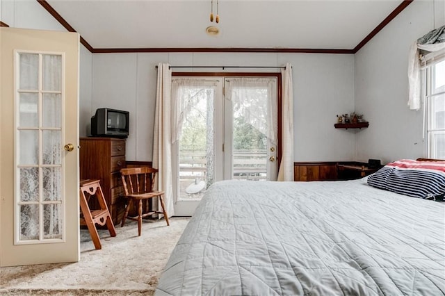 bedroom with access to exterior, ornamental molding, and carpet