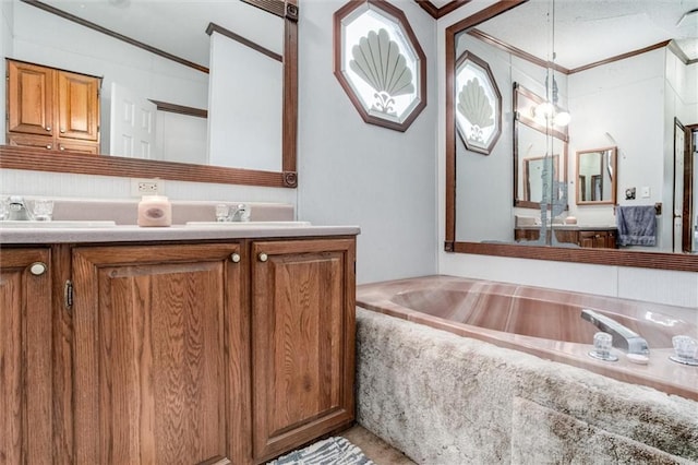bathroom with double vanity, a sink, and crown molding