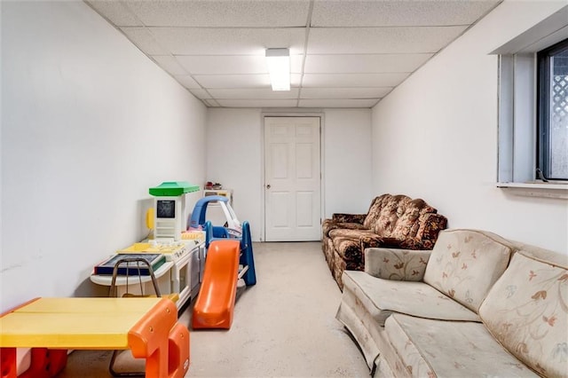 interior space featuring a drop ceiling and carpet
