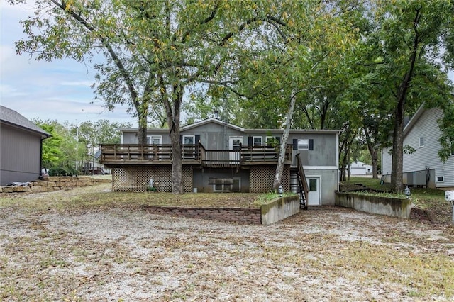 back of house with stairway and a wooden deck