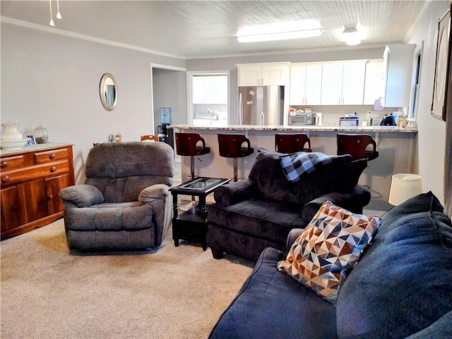 living room featuring light carpet and ornamental molding