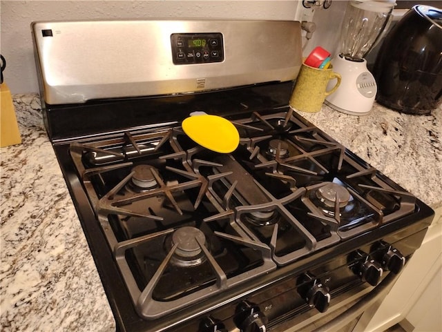 room details featuring stainless steel gas stove