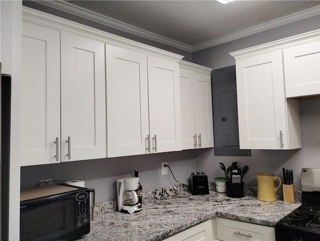 kitchen featuring white cabinetry and range with gas stovetop