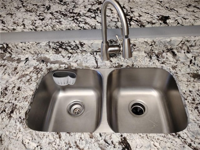 interior details with light stone counters and sink