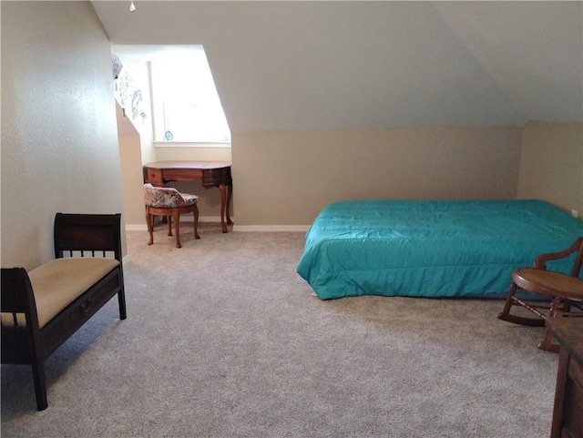 carpeted bedroom with vaulted ceiling