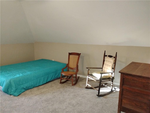 bedroom featuring vaulted ceiling and carpet flooring