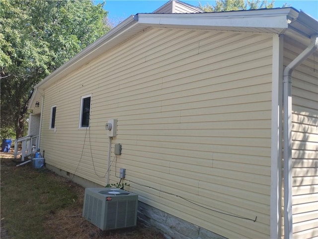 view of property exterior with central AC unit