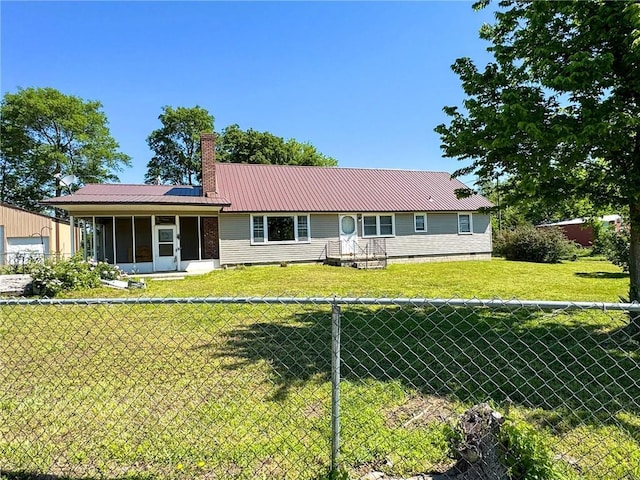 10784 SW 70th St, Chetopa, KS 67336 - back of house with a chimney, metal roof, a sunroom, a garage, and solar panels