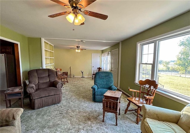 10784 SW 70th St, Chetopa, KS 67336 - living room featuring ceiling fan, carpet floors, and baseboards