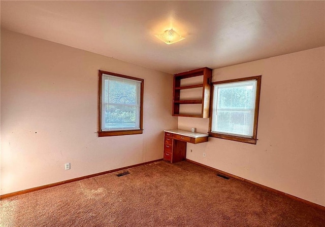 10784 SW 70th St, Chetopa, KS 67336 - unfurnished room featuring plenty of natural light, carpet flooring, and baseboards