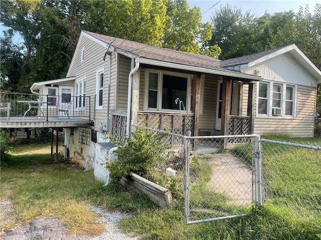 view of front of home with a front yard and a porch