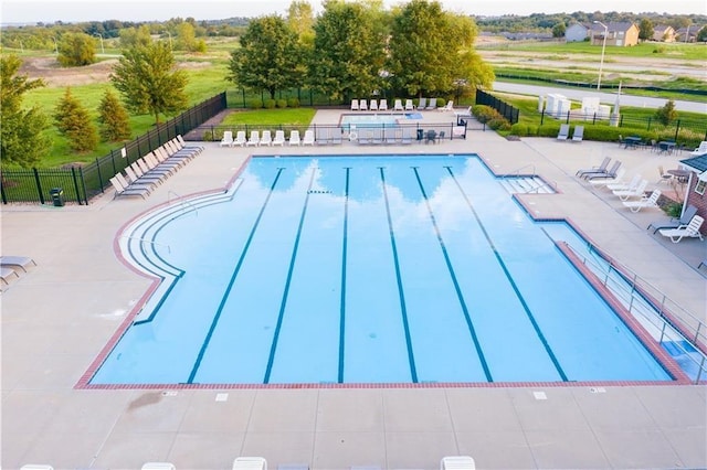 view of swimming pool featuring a patio area