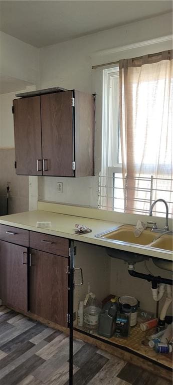 kitchen featuring decorative backsplash, dark hardwood / wood-style floors, and sink