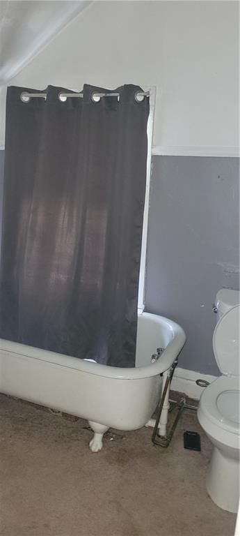 bathroom with a bathtub and toilet