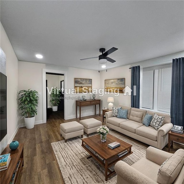 living room with dark wood-type flooring and ceiling fan