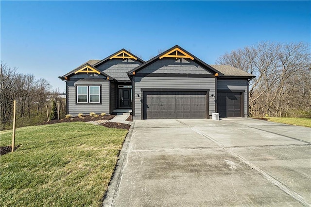 view of front of house featuring a front yard and a garage