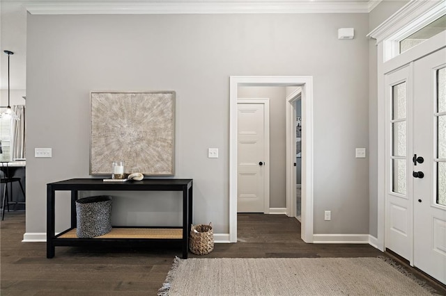 entryway featuring crown molding and dark wood-type flooring