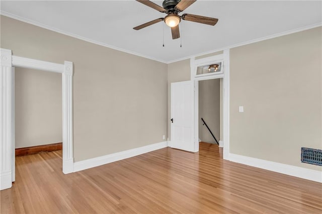 interior space with ceiling fan, light wood-type flooring, and crown molding