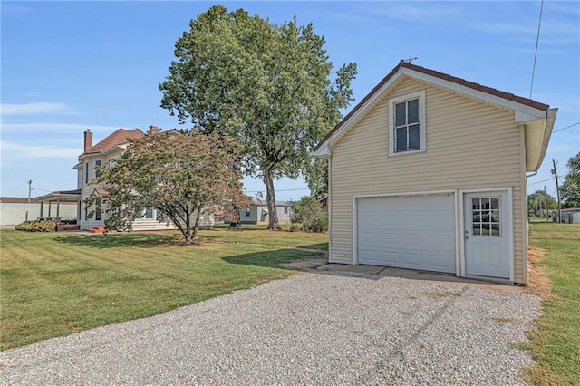 exterior space with a yard and a garage