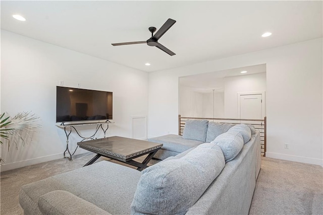 living room featuring ceiling fan and light colored carpet