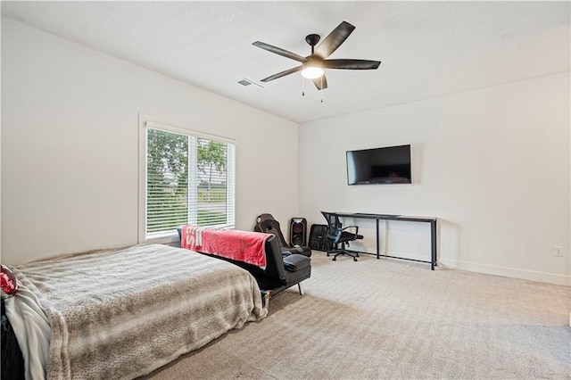 carpeted bedroom with ceiling fan