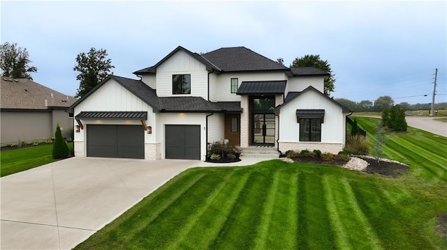 modern inspired farmhouse featuring a front lawn and a garage