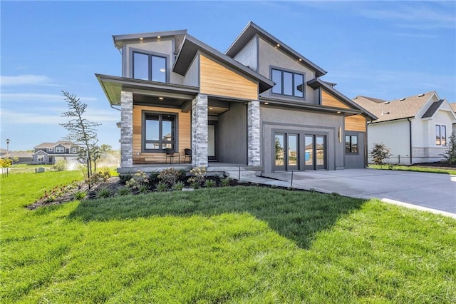 modern home featuring a front yard