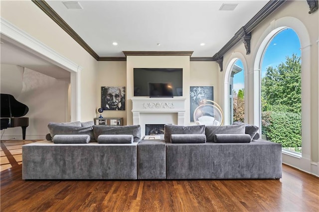 living room with wood-type flooring and ornamental molding