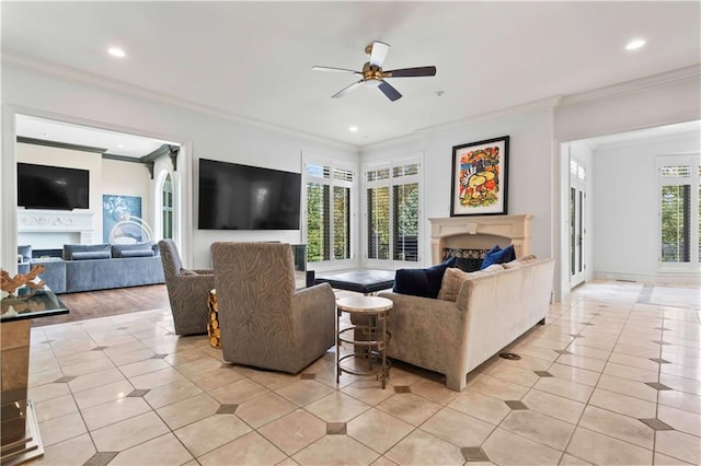 living room featuring crown molding, light wood-type flooring, and ceiling fan