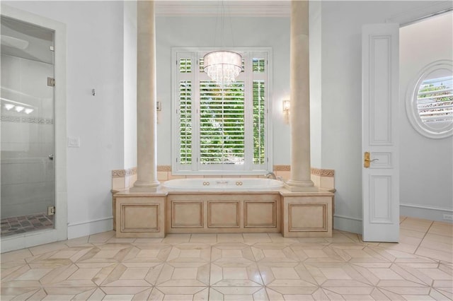 bathroom with ornate columns, ornamental molding, shower with separate bathtub, and a chandelier