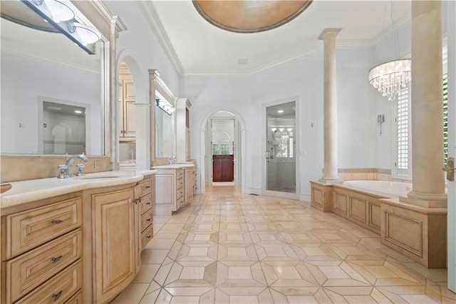 bathroom featuring ornate columns, plus walk in shower, crown molding, a notable chandelier, and vanity