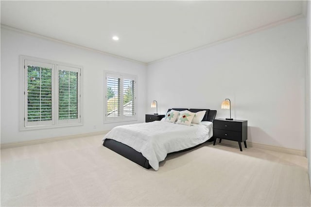 carpeted bedroom with ornamental molding