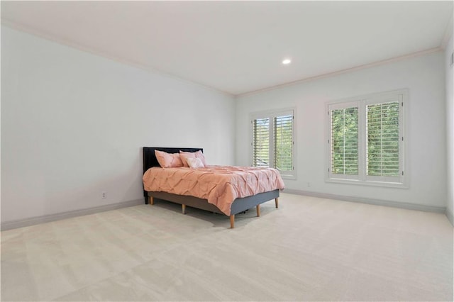 carpeted bedroom featuring crown molding