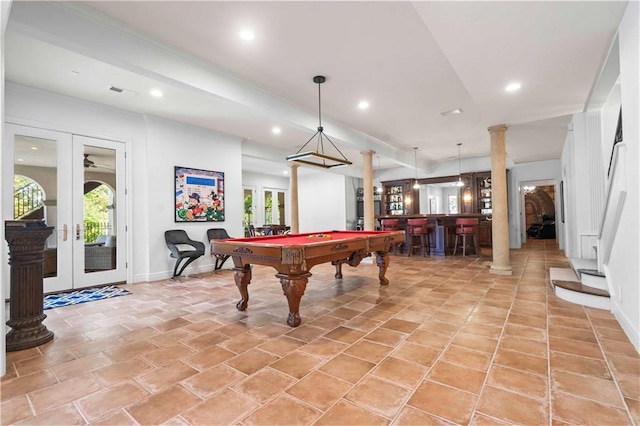 game room with pool table, bar area, decorative columns, french doors, and light tile patterned floors