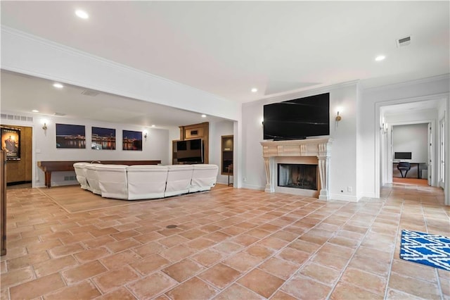 unfurnished living room with ornamental molding