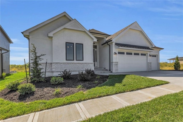 view of front of property with a front lawn and a garage