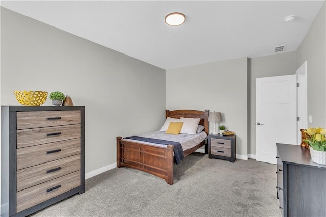 bedroom with light colored carpet