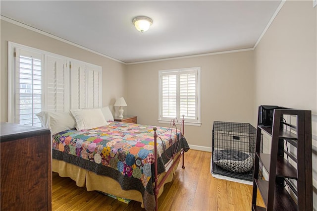 bedroom featuring hardwood / wood-style flooring and ornamental molding