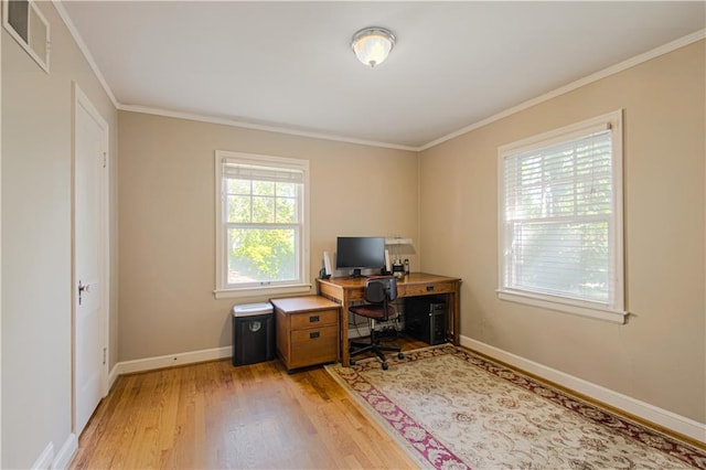 office space featuring ornamental molding and light wood-type flooring