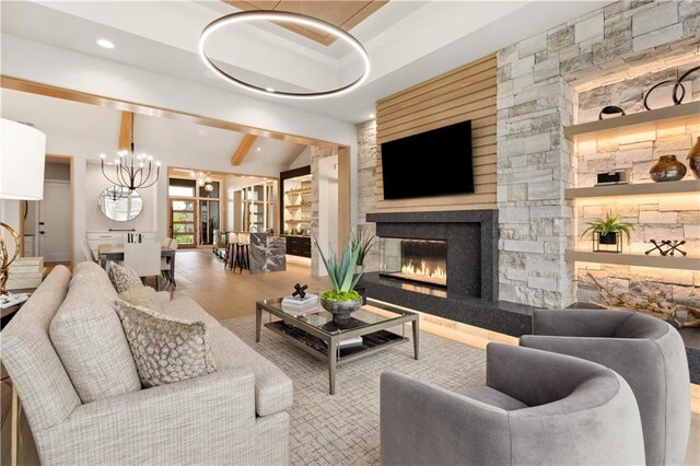 12303 W 167th Ter, Overland Park, KS 66221 - living room featuring a glass covered fireplace, a chandelier, and recessed lighting