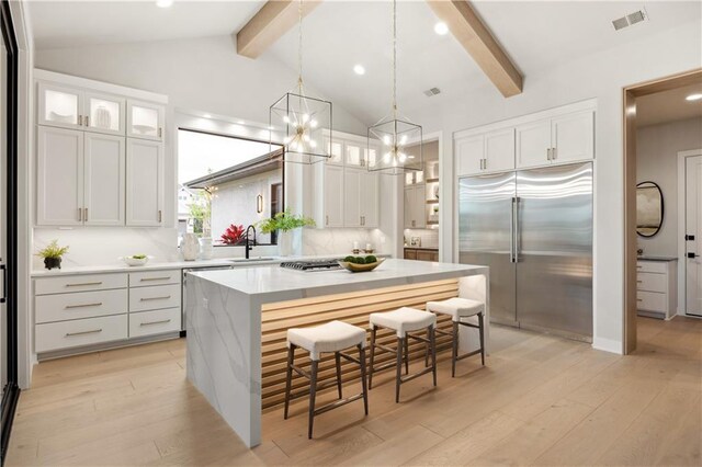12303 W 167th Ter, Overland Park, KS 66221 - kitchen with stainless steel appliances, a sink, white cabinets, and recessed lighting