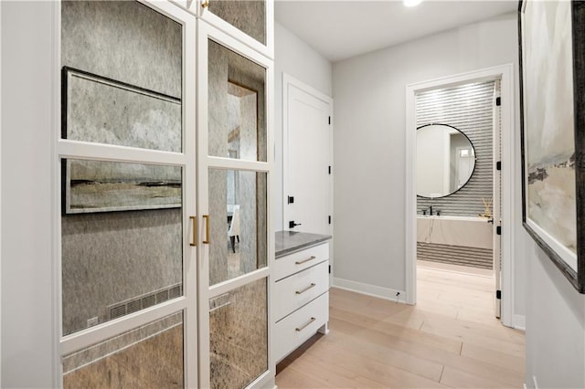 12303 W 167th Ter, Overland Park, KS 66221 - bathroom with wood finished floors, baseboards, and vanity