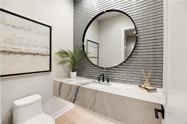 12303 W 167th Ter, Overland Park, KS 66221 - bathroom with backsplash, toilet, and a sink