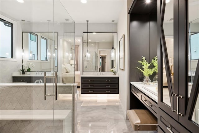 12303 W 167th Ter, Overland Park, KS 66221 - bathroom with two vanities, marble tiled floors, and a stall shower