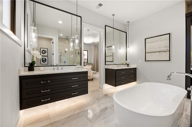12303 W 167th Ter, Overland Park, KS 66221 - bathroom with a freestanding bath, two vanities, marble tiled floors, a stall shower, and recessed lighting