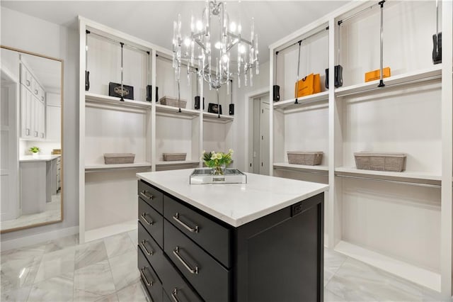 12303 W 167th Ter, Overland Park, KS 66221 - walk in closet with light marble finish flooring and a chandelier