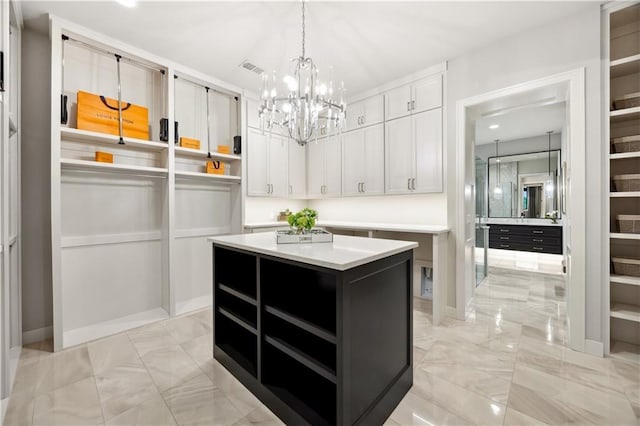 12303 W 167th Ter, Overland Park, KS 66221 - spacious closet featuring light marble finish floors and a chandelier