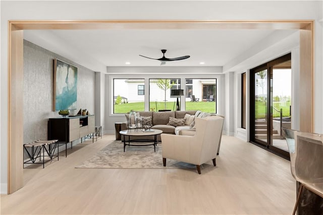 12303 W 167th Ter, Overland Park, KS 66221 - living area featuring light wood-type flooring, ceiling fan, and baseboards