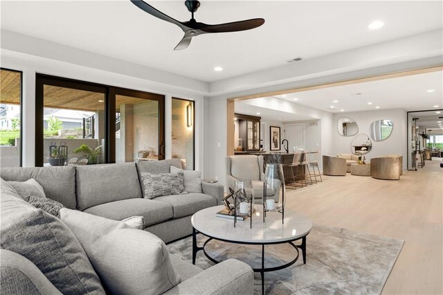 12303 W 167th Ter, Overland Park, KS 66221 - living area featuring a ceiling fan, light wood-type flooring, and recessed lighting
