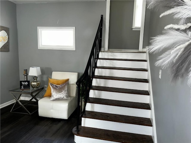 stairs featuring wood-type flooring